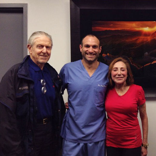 Dr Froum Standing with Two Patients