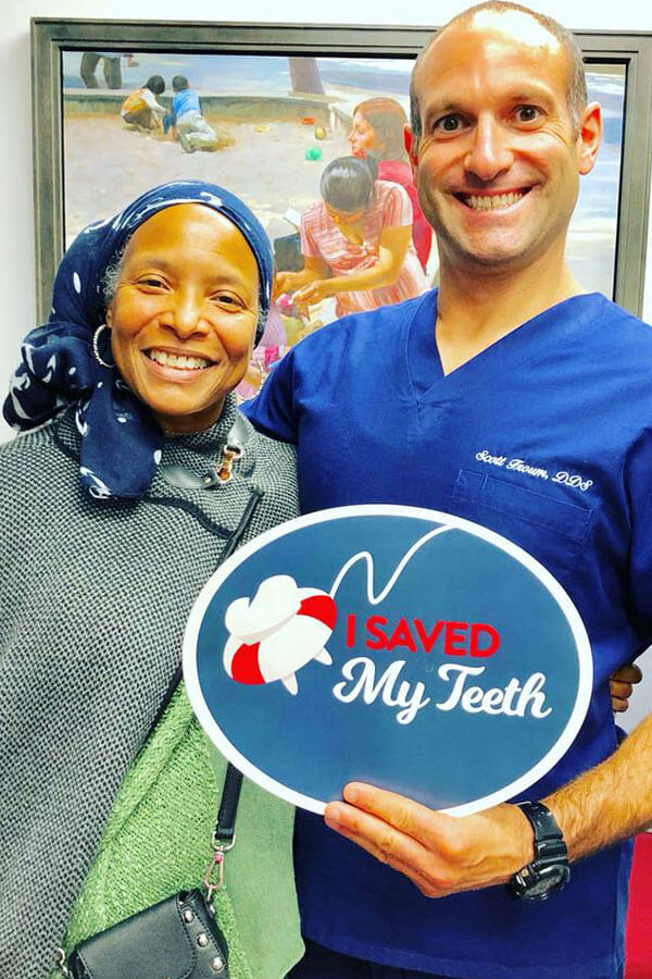 Dr Froum with Patient holding I Save My Teeth Sign